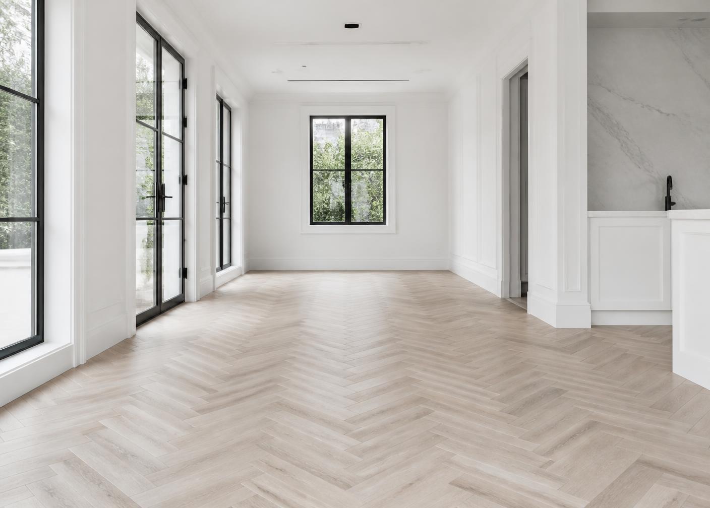 Patterned wood flooring laid across a light, sunlit interior