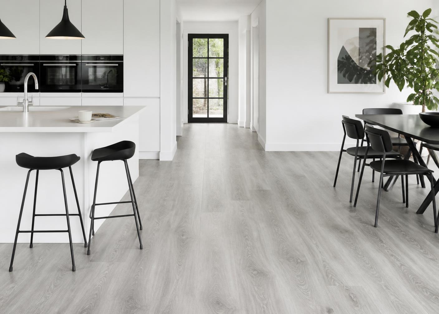 Wood-look flooring in a bright utility space with daylight across the surface